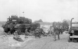 Troops of 3rd Division on Queen beach, Sword area, 6 June 1944. On the left, medics attend to ...jpg